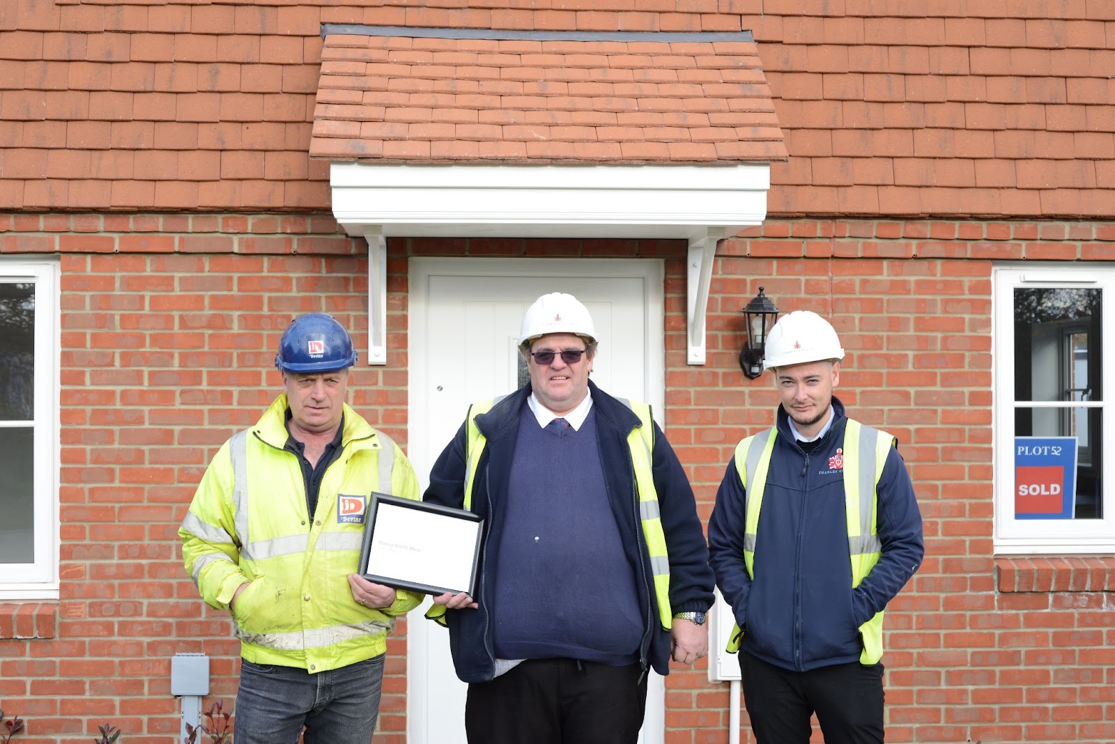 The team standing proud with their award at Mulberry Grange, Westvale Park, Horley. 